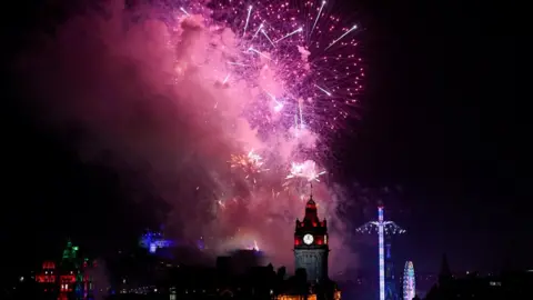 Reuters Fireworks light up the sky over Edinburgh Castle and the Balmoral Clock to mark the New Yea