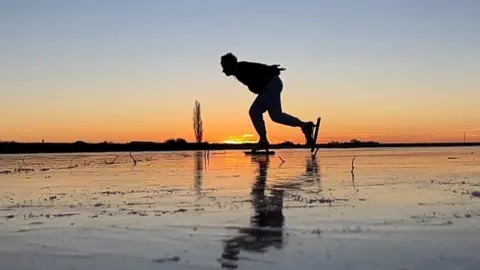 Ice skater on a frozen Fen