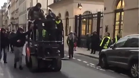 AFP Protesters on a forklift truck in Paris, 5 January