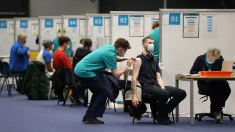 Liam McBurney/PA Media People getting their Covid vaccination