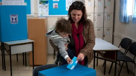 AFP Israeli woman voting in Jerusalem (file photo)