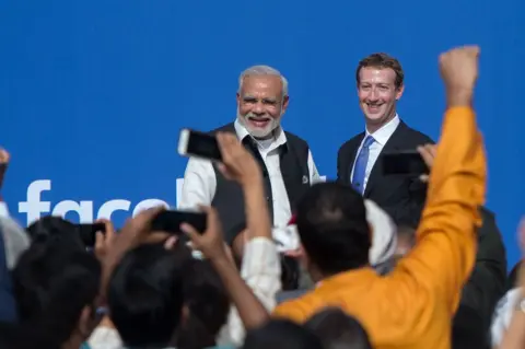 Getty Images Indian Prime Minister Narendra Modi (L) and Facebook CEO Mark Zuckerberg at a Townhall meeting in California.