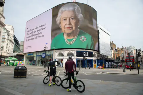 Dominic Lipinski / PA Media The Queen displayed in London’s Piccadilly Circus