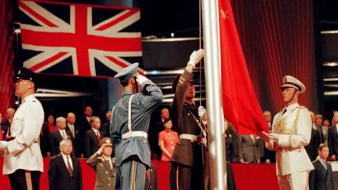 Reuters The Chinese flag is raised by People's Liberation Army (PLA) soldiers at the handover ceremony on 1 July 1, 1997