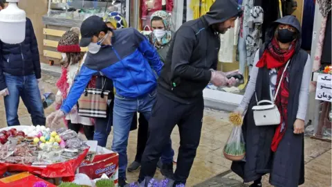 Getty Images Shoppers in a Tehran bazaar