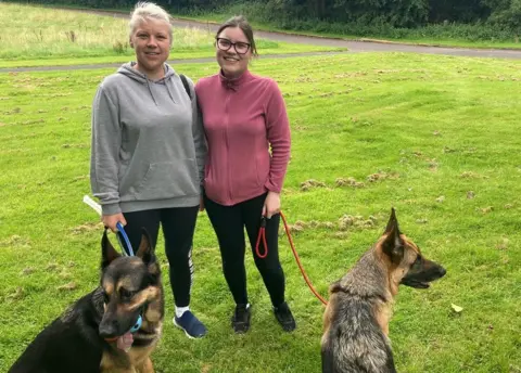 Ilona and Karolina with their dogs