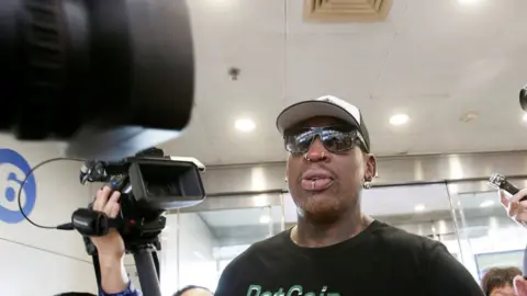 Reuters  Dennis Rodman mobbed by the press en route to Pyongyang