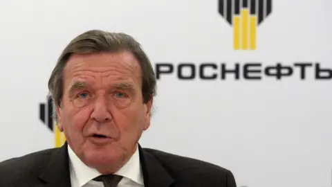 AFP Former German Chancellor Gerhard Schroeder, newly elected chairman of the board of directors of Russia's oil giant Rosneft, speaks at a briefing in Saint Petersburg on Friday