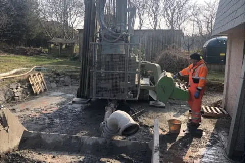 bore hole being drilled for a heat pump