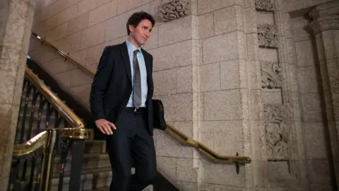 Canadian Prime Minister Justin Trudeau walks to the House of Commons