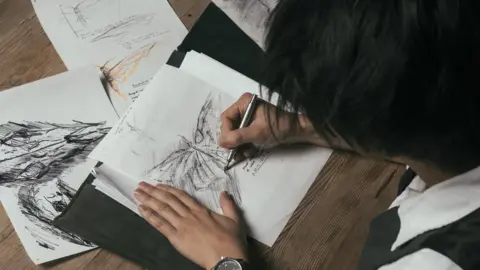 Frank To Frank To working on one of his drawings