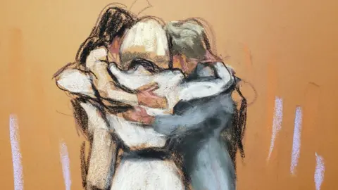 Reuters E Jean Carroll hugs her team after the verdict was read out