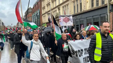 BBC protestors with flags and signs in Belfast city centre