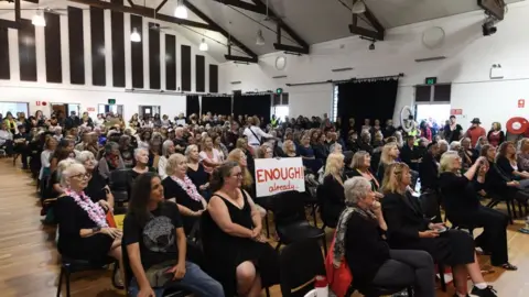 Getty Images Locals gather into a hall in Mullumbimby for a March 4 Justice protest