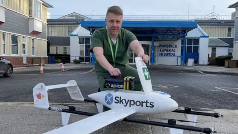 Apian Mark Knowles, pharmacy head of production, and the drone