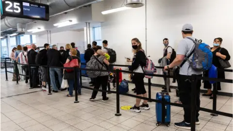 Getty Images Passengers waiting to board a flight