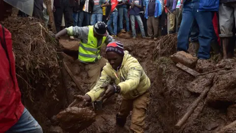 AFP Villagers dig through mud as they attempt to find survivors of flash flooding at Solai in Subukia, Nakuru County on May 10, 2018,