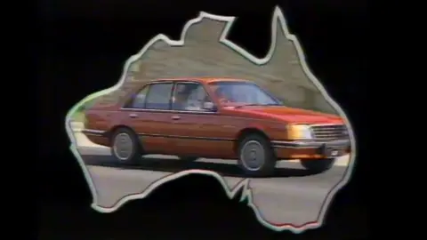 Holden A image from a 1970s advert showing a Holden car inside a map of Australia