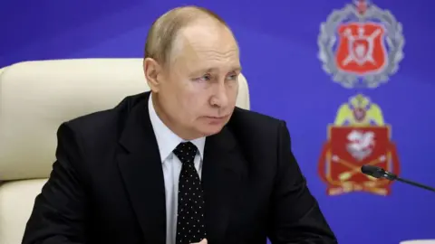 Getty Images President Putin at the military briefing