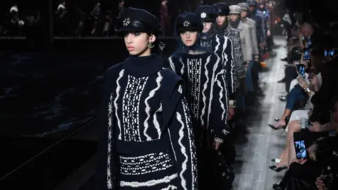 Getty Images Models walk in a Chanel fashion show in Moscow in 2018