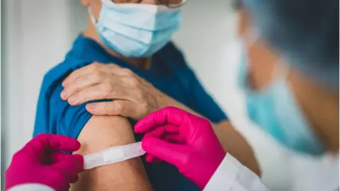 Getty Images Woman who has just had injection