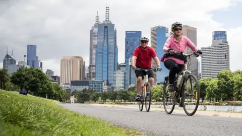 Getty Images People enjoy riding bicycles along the Yarra River on November 19, 2020 in Melbourne, Australia