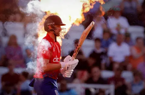 Andrew Couldridge / Reuters England's Will Jacks as fire sprays behind him as part of a display, 5 September 2023