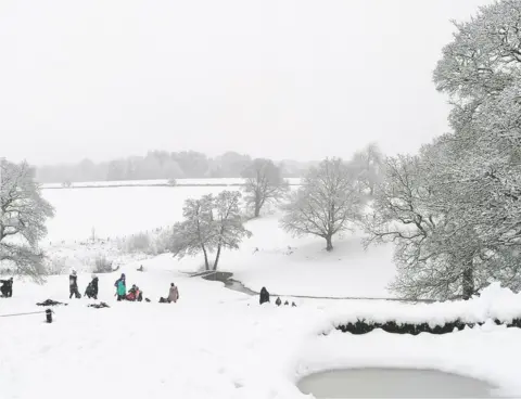 Markovitch/Weather Watchers People in the snow in Adel, Leeds