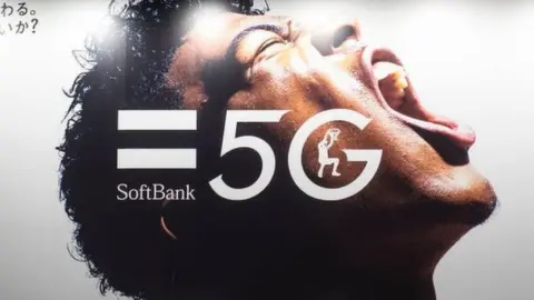 Getty Images SoftBank advertises on a billboard a 5G high-speed internet network in Tokyo.