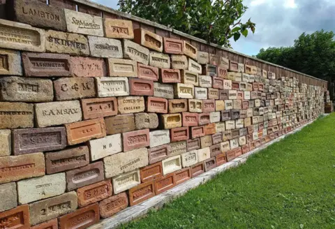 Chris Tilney Bricks formed into a temporary wall in Chris Tilney's garden