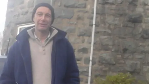 Trevor Grooms Trevor Grooms outside his home