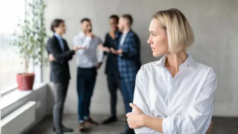 Getty Images Woman is excluded from group