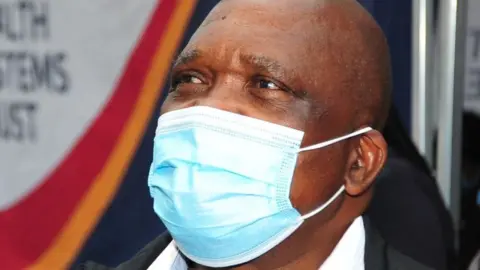 Getty Images Joseph Phaahla, SA Minister of Health during Vooma Vaccination Campaign on October 03, 2021 in Durban, South Africa.