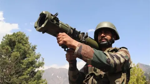 Getty Images An Indian Army Soldier looks through a 84 MM RL Gun at a Forward Post at LoC Line Of Control in Uri, Baramulla, Jammu and Kashmir, India on 02 April 2022. T