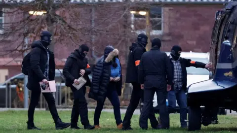 Reuters A person arrested in Germany