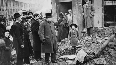 Getty Images Winston Churchill in Bristol after the city was hit by German bombing raids