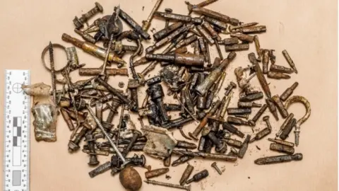 Met Police  Shrapnel: Some of the metal parts recovered from the bomb