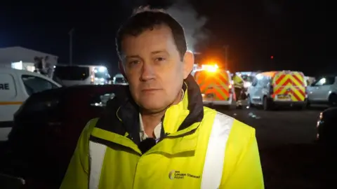 Jamie Niblock/BBC Neil Thomson at London Stansted Airport