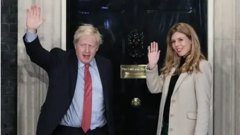 PA Media Prime Minister Boris Johnson and his girlfriend Carrie Symonds