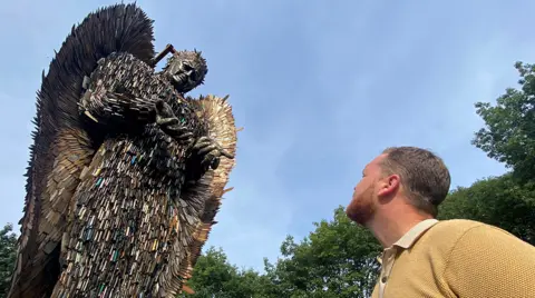 John Fairhall/BBC Knife Angel with artist Alfie Bradley