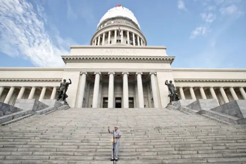 Getty Images Eusebio Leal delivers a speech in front of El Capitolio, the National Capitol Building, for the unveiling of the cover of the dome on August 30, 2019, in Havana, Cuba.