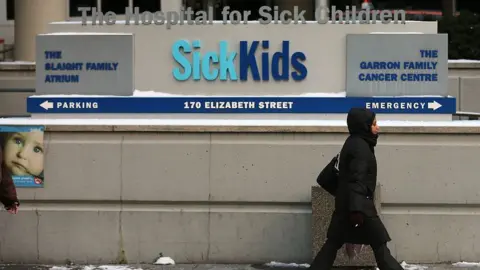 Getty Images A person walks by SickKids hospital