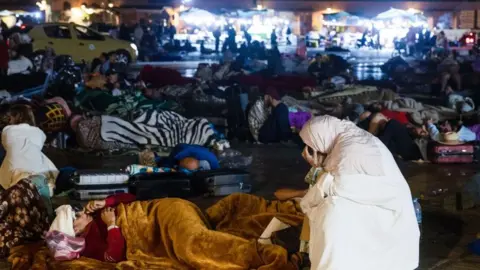 Getty Images People sleeping on the streets in central Marrakesh