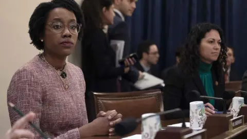 JIM WATSON # Rep Lauren Underwood, sitting at the hearing