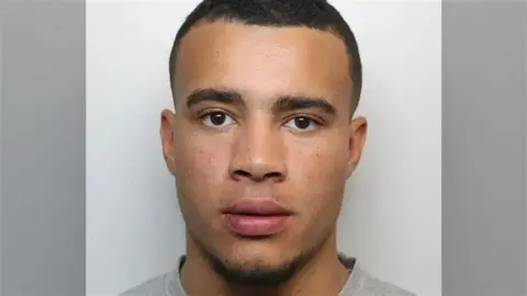 Surrey Police A police custody image of Harrison Sullivan