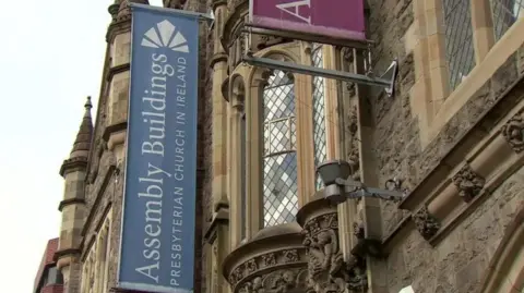 The picture shows the outside of the Presbyterian Church's Assembly Buildings