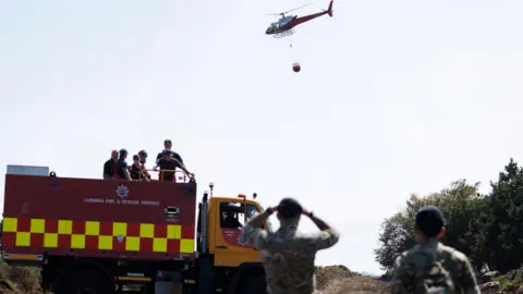 MOD Soldier watches a helicopter 