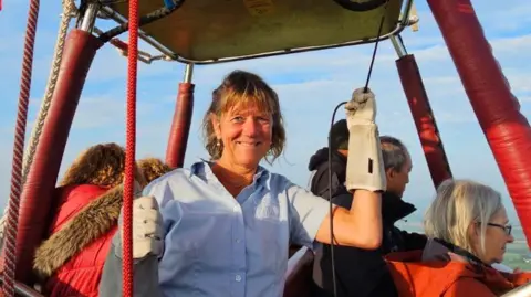 ALLIE DUNNINGTON Allie Dunnington flying a commercial Virgin hot air balloon 