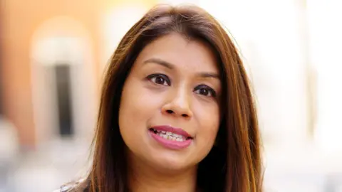 PA Media A close up image of Tulip Siddiq standing outside Downing Street