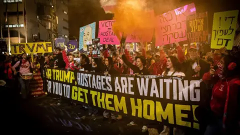 Getty Images Protesters call on Donald Trump to ensure the Gaza ceasefire deal is fully implemented and all of the Israeli hostages held by Hamas are released, in Tel Aviv, Israel (1 February 2025)